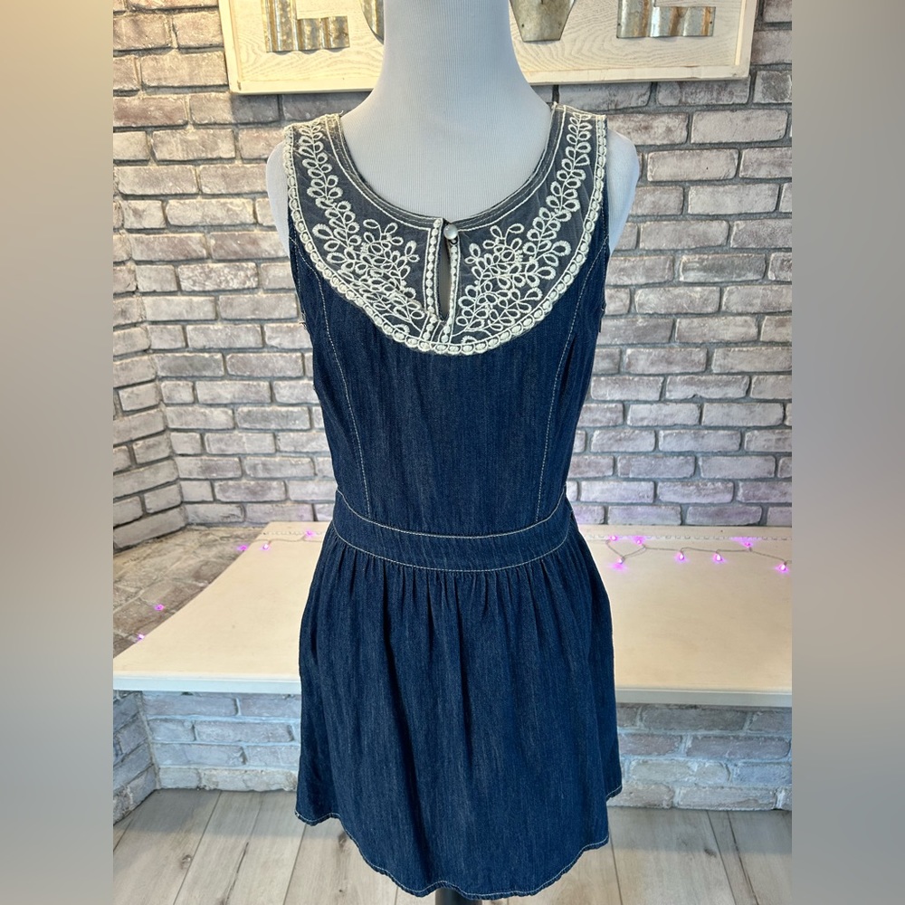 Dark denim dress with lace panelling detail.